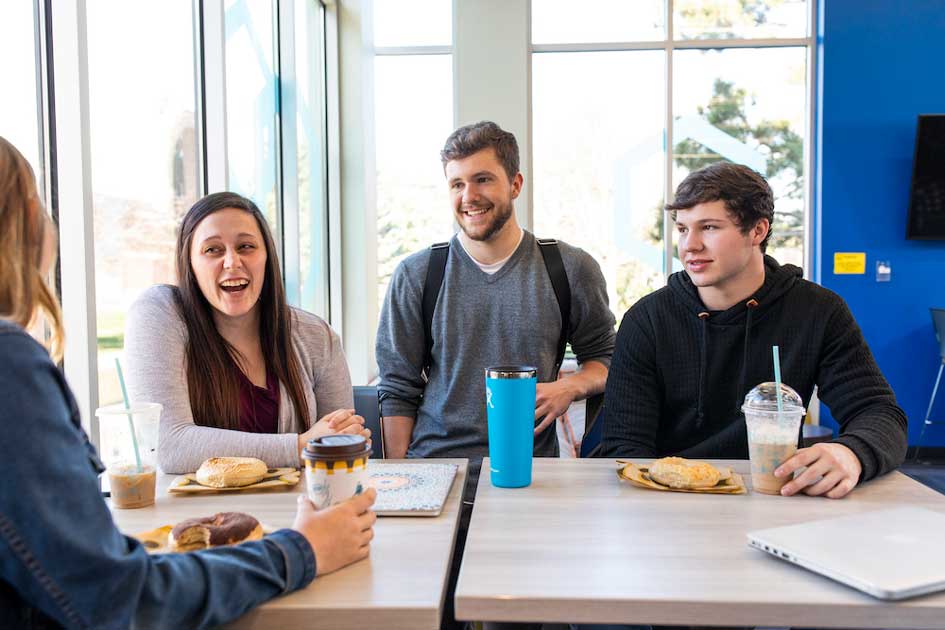 students eating lunch at a table